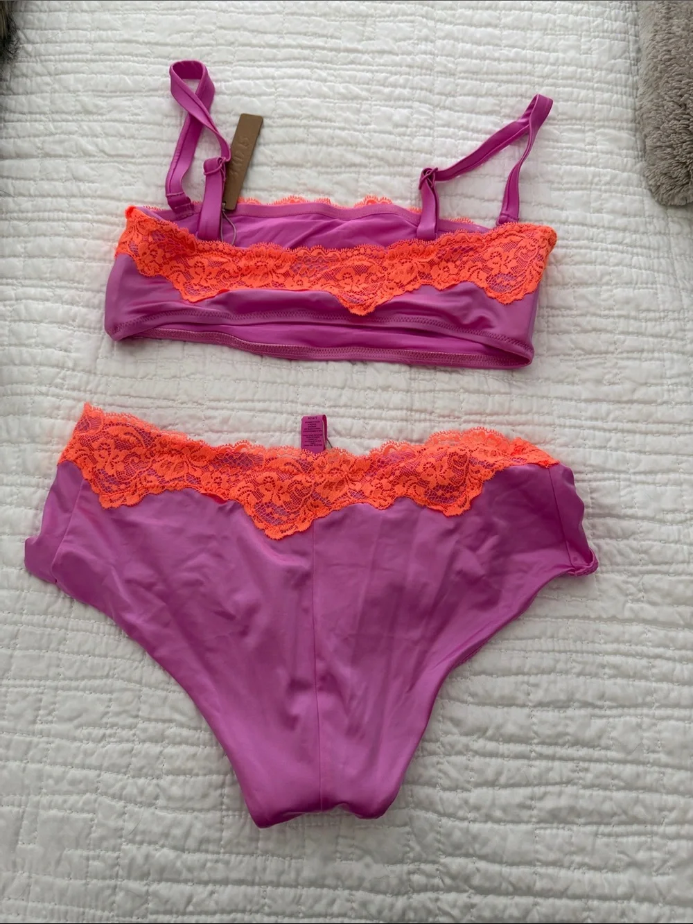 SKIMS Two-Piece Swim Bikini in Magenta with Neon Orange Lace